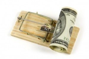 dollar bills in a mousetrap